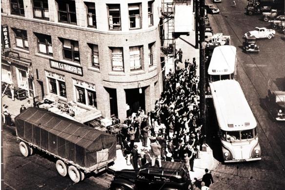 historic building buses taking people to camp